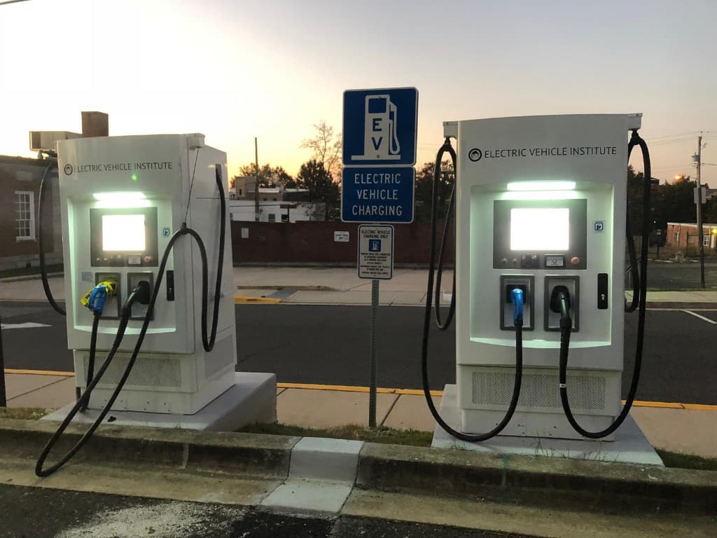 Two Electric Vehicle Institute Level 2 EV chargers at our Hyattsville hub at sunset