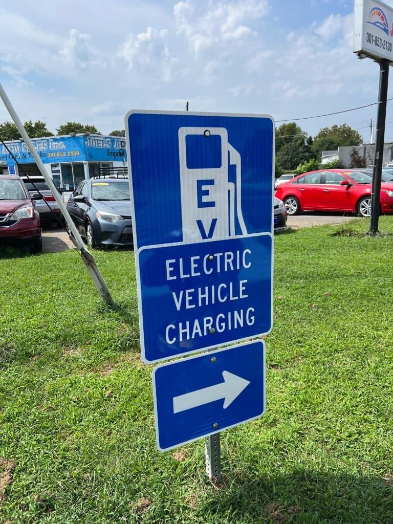 EV charging directional sign at our Hyattsville EV Charging Hub